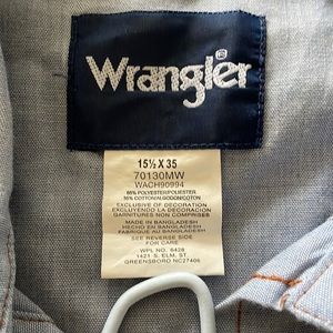 Cowboy style light blue Wrangler Shirt. Tag reads 151/2 x35.  Very nice details.